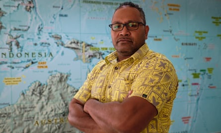 Tevita Tupou, from the Oceania Customs Organisation, in front of a Pacific region map