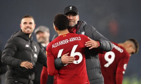 Jurgen Klopp, Manager of Liverpool embraces Trent Alexander-Arnold of Liverpool after the final whistle.