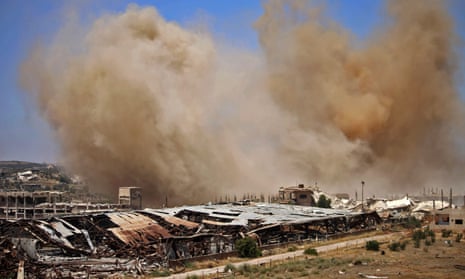 Smoke rises above opposition-held areas of Daraa province on Wednesday.
