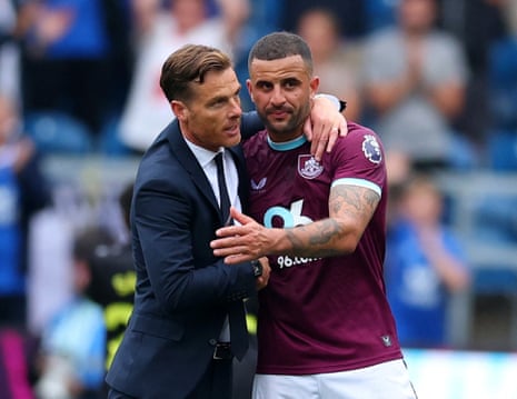 Burnley manager Scott Parker and Kyle Walker celebrate their victory.