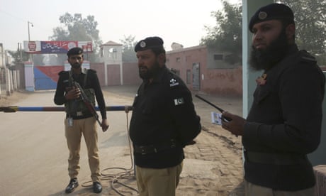 Police officers stand guard outside Multan jail
