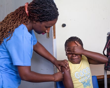 A 10-year-old girl reacts after receiving a free dose of the HPV vaccine at Budiriro polyclinic in Harare, Zimbabwe.