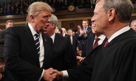 Donald Trump with supreme court chief justice John Roberts as Trump arrives to deliver his first address to a joint session of Congress in Washington DC on 28 February 2017.