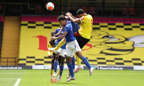 Troy Deeney of Watford outjumps James Justin of Leicester City but his header goes just wide of the Foxes’ goal.