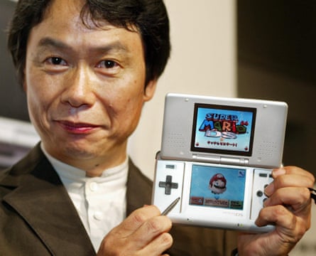 Nintendo’s Shigeru Miyamoto shows off the Nintendo DS at launch.