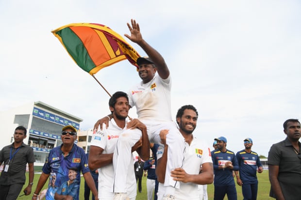 Rangana Herath is chairlifted around the pitch.