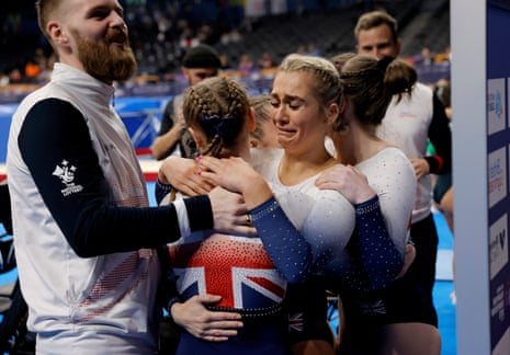 Bethany Williamson of Great Britain crying with joy after seeing her final vault gain enough points to give her team the gold medal in the women’s double mini trampoline team final