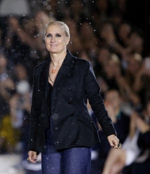 Italian fashion designer Maria Grazia Chiuri acknowledges the applause at the end of the show.