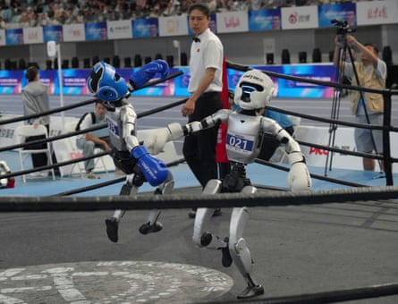 Humanoid robots compete in the free combat during the World Humanoid Robot Games in Beijing.