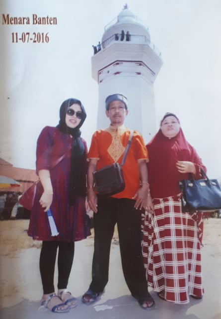 Siti Aisyah with her father Asria and mother Benah at Banten Central Park during the Eid holiday in July 2016, in one of their last photos together before she was arrested.