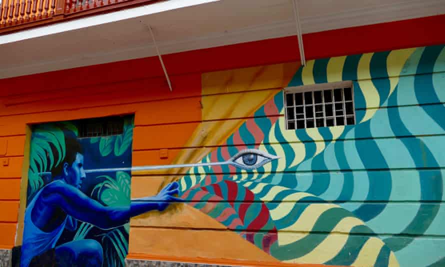 A mural painting with crouching figure in Callao, Lima