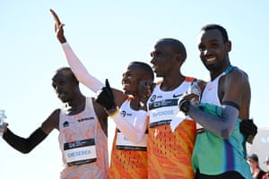 Runners wave to the crowd