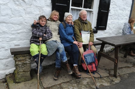 Family group outside a pub in hiking clothes