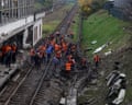 Workers repair railway tracks at a Kyiv metro station damaged by a missile strike