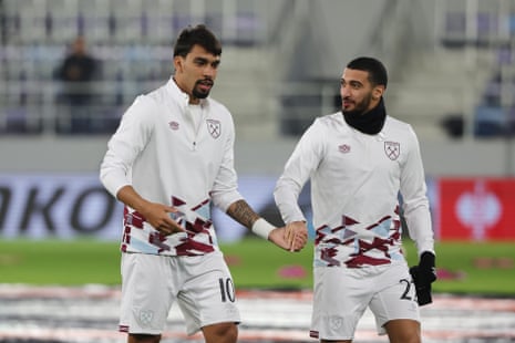 Lucas Paqueta and Said Benrahma hold hands on the pitch