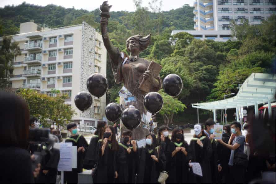 Students gather at the CUHK’s Goddess of Democracy statue in 2020. The monument has since been removed.
