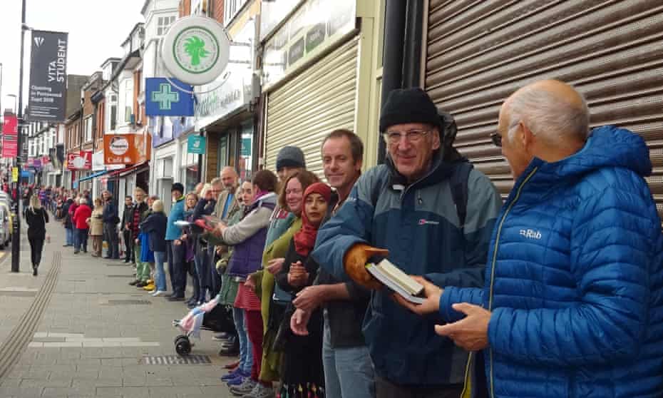 Volunteers hand books down a human chain in Southampton.