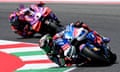 Francesco Bagnaia, whose Ducati bike was decked out in blue for the occasion, leads Jorge Martín at Mugello.