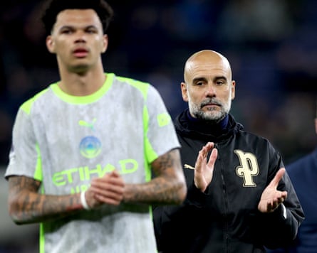 City manager Pep Guardiola and player Nico O’Reilly applaud fans at the end of the 3-3 draw against Everton