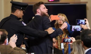 Owen Shroyer of Infowars is removed from the hearing.