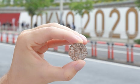 The Team GB Tokyo 2020 Olympics 50p coin outside the Tokyo Olympic Stadium.