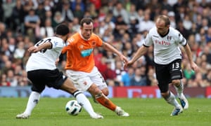 Charlie Adam takes on Mousa Dembélé and Danny Murphy in April 2011.