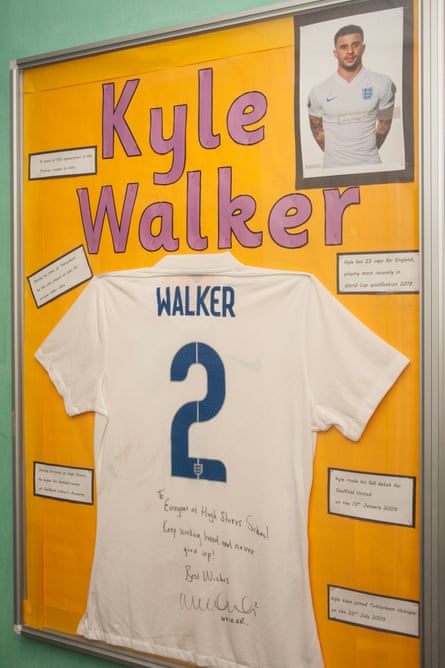 A signed England shirt from Kyle Walker adorns a wall at High Storrs school’s gym.