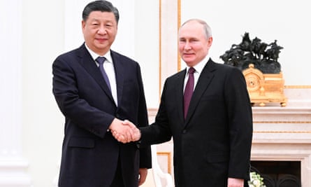 China’s President, Xi Jinping, is greeted by Russia’s President, Vladimir Putin, at the Kremlin in Moscow on 20 March.