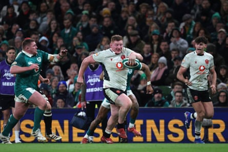 Wales’ Rhys Carré, centre, breaks through to score his team’s first try against Ireland last week