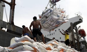 Indonesian workers load rice on a truck at Tanjung Priok Port in Jakarta, Indonesia, on 14 November. Indonesia will import about 1.5m tonnes of rice from Vietnam due to the impact of El Niño.