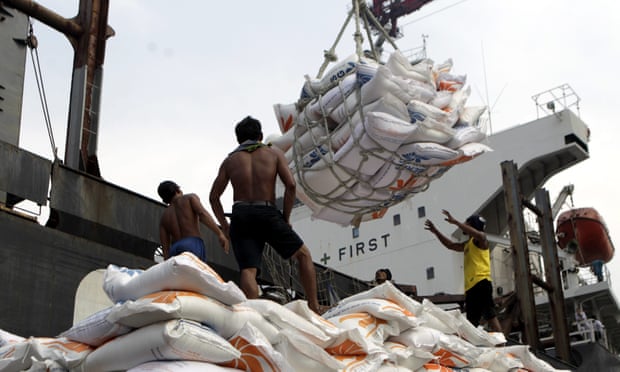 Indonesian workers load rice on a truck at Tanjung Priok Port in Jakarta, Indonesia, on 14 November. Indonesia will import about 1.5m tonnes of rice from Vietnam due to the impact of El Niño.