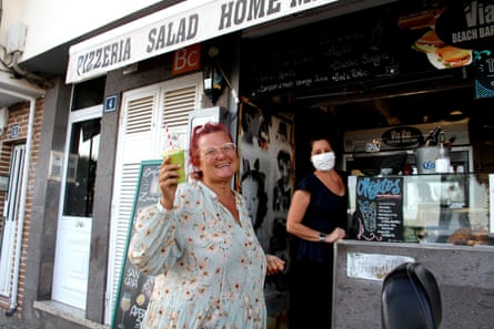 A bar reopens in Tenerife as lockdown measures are eased.