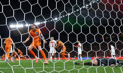 Netherlands’ Wout Weghorst celebrates after Stefan de Vrij scores their first goal.