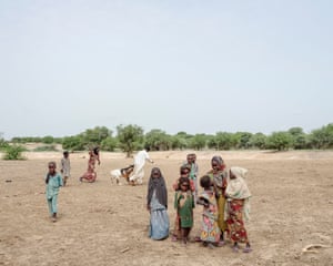 People gather at a cattle vaccination site.