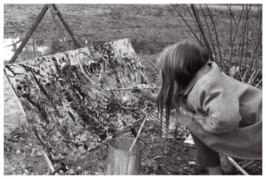 Picture of Mary Nolan’s daughter Alice painting outside.