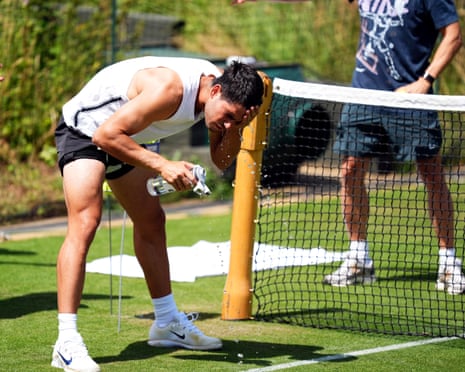 Carlos Alcaraz cools off during a practice session on day two of the 2025 Wimbledon Championships at the All England Lawn Tennis and Croquet Club, London.