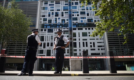 Police guard a cordon near the Home Office in Westminster.