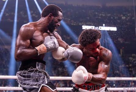 Terence Crawford, left, soundly beat Errol Spence Jr in 2023 to become the first male fighter to claim undisputed championships in two weight classes in the four-belt era.
