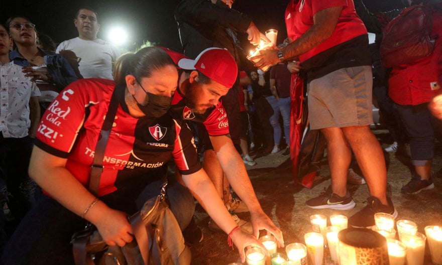 Atlas fans take part in a prayer vigil after Saturday’s violence