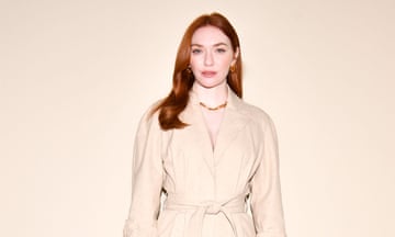Actor Eleanor Tomlinson in creamy suit against similar background