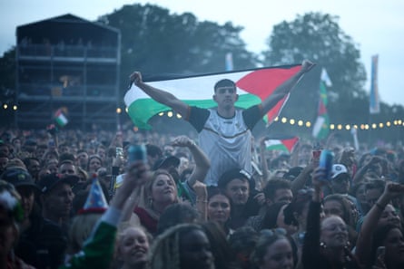 Festivalgoers wait to hear Kneecap perform on stage at Wide Awake in Brockwell Park, south London.