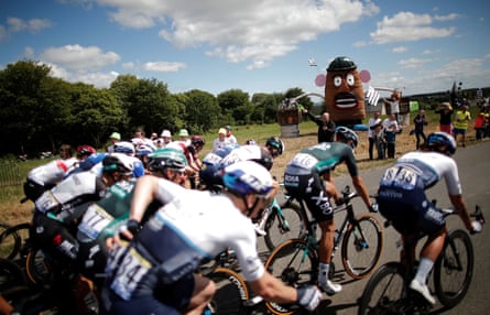 The peloton passes a large Mr Potato Head.