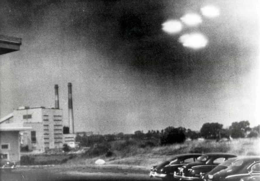 This picture, taken through the window of a laboratory by a 21-year-old US coastguard, shows four unidentified flying objects as bright lights in the sky, at Salem, Massachusetts, on 3 August 1952.