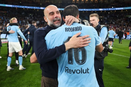 Pep Guardiola celebrates with Rodri after Manchester City’s 2-0 win over Arsenal in the Carabao Cup final.