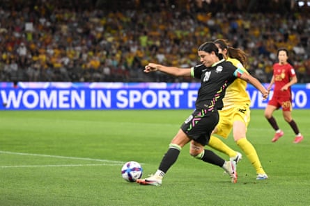 Sam Kerr beats goalkeeper Peng Shimeng to put Australia in the lead.