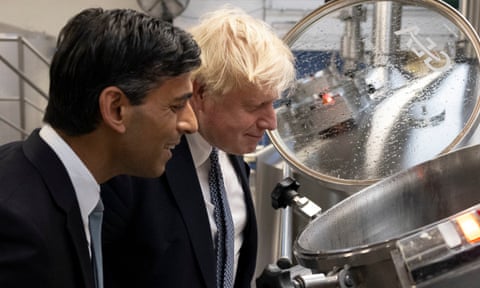 Rishi Sunak with Boris Johnson who is staring down the barrel of criticism from his own MPs.