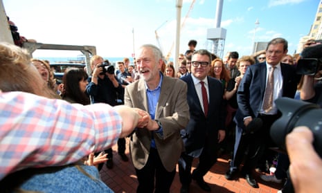 Jeremy Corbyn and his deputy Tom Watson greeted by supporters