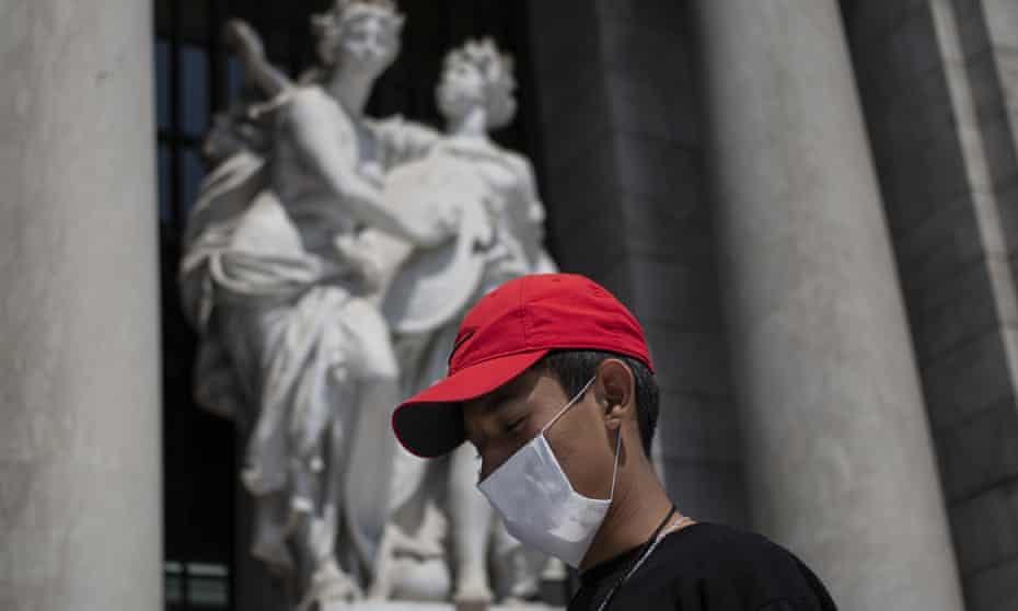 A boy wears a mask, behind of he the Beauty Arts Palace on February 28, 2020 in Mexico City, Mexico. The Secretariat of Health of Mexico has announced the first two confirmed cases of Covid-19. 