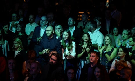 People react as Progressive Slovakia party leader Michal Šimečka speaks on stage at his party’s headquarters.