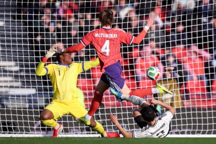 Scott McTominay is tackled by Yukinari Sugawara
